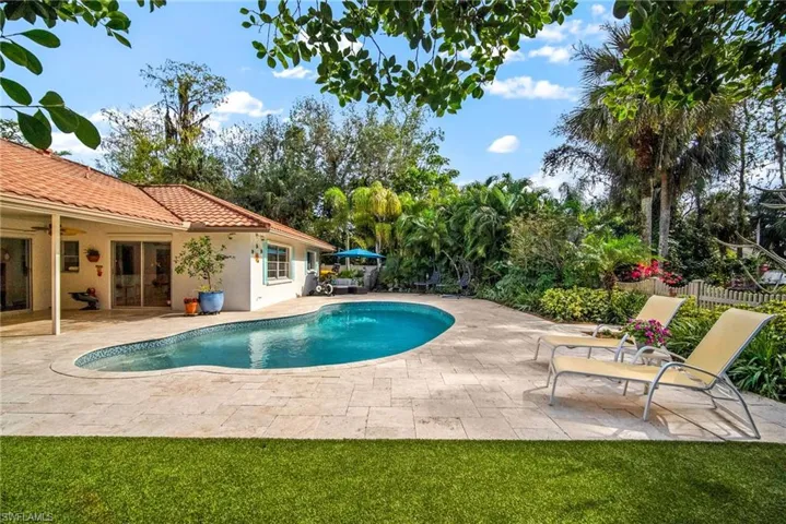 View of swimming pool with a patio area