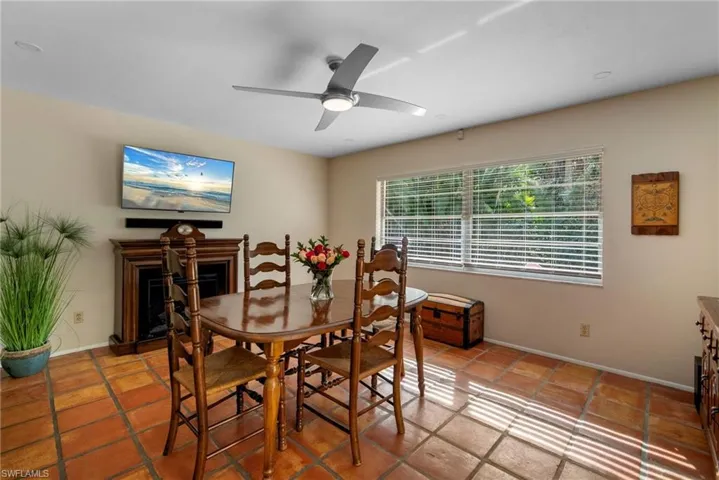 Dining space featuring tile patterned flooring and ceiling fan