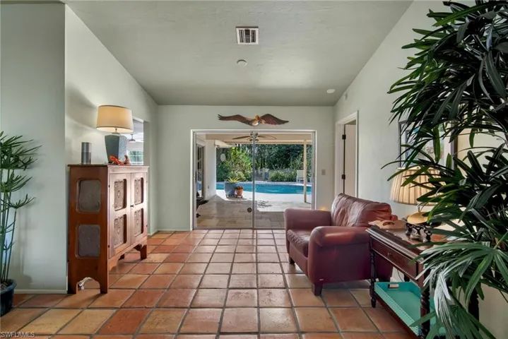 Tiled living room with ceiling fan