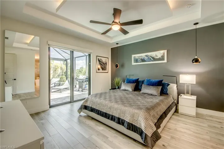 Owners Suite with sliding doors to the lanai