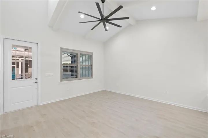 Living Room with Vaulted Ceilings and Upgraded Plantation Shutters and Ceiling Fan