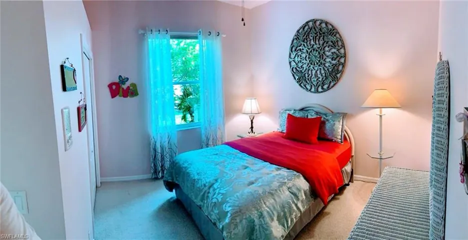 Bedroom with carpet flooring and closet
