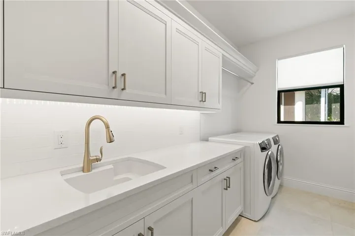 Laundry area with washer and dryer and cabinet space