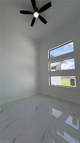 Unfurnished room featuring marble finish floor
