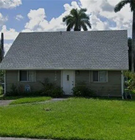 View of front of property with a front yard