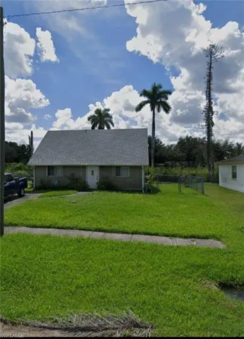 View of front of house featuring roof with shingles