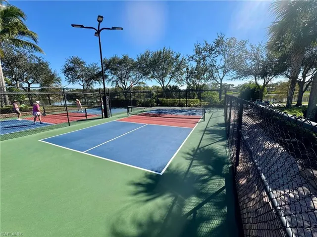View of tennis court featuring community basketball court