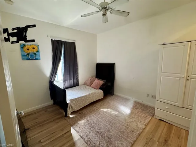 Bedroom featuring light wood-style flooring and a ceiling fan