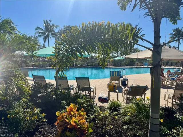 Community pool featuring a patio
