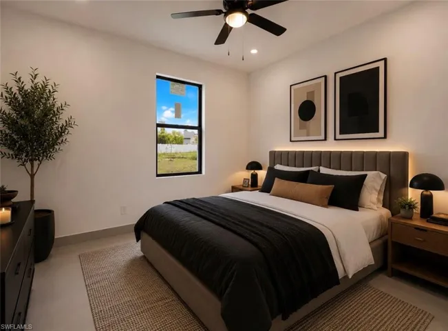 Spacious room featuring a single window with black trim, recessed lighting, and a ceiling fan