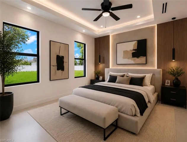 Recessed lighting and a ceiling fan complement a tray ceiling