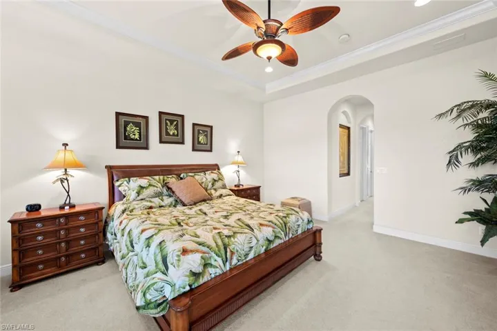 Hall leads to en-suite bath and walk-in closets