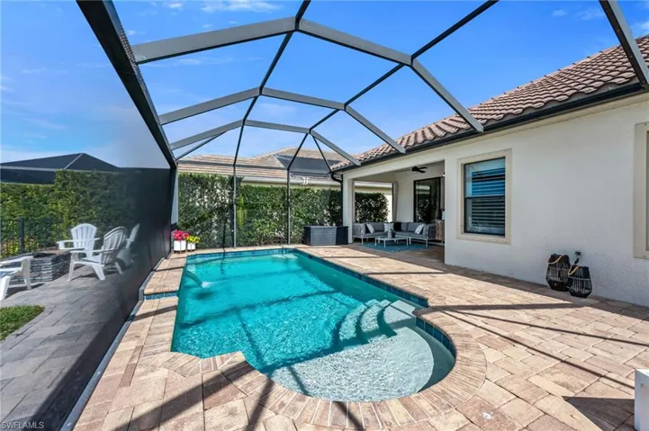 Outdoor Pool Featuring Under Cover Seating