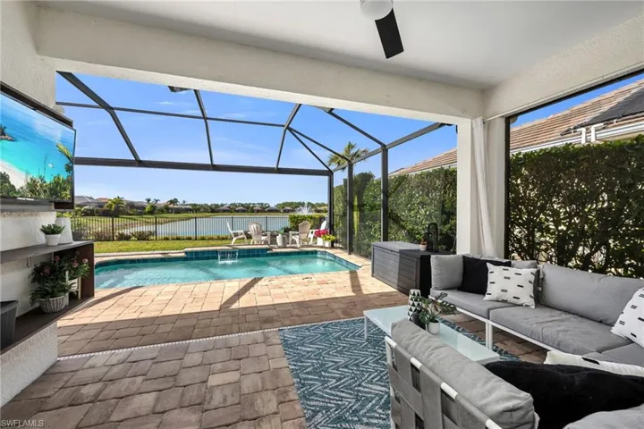 Swimming Pool with Picture Window Screen and Sitting Area. Featuring A Long Lake Western View.