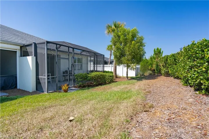 View of yard featuring a lanai