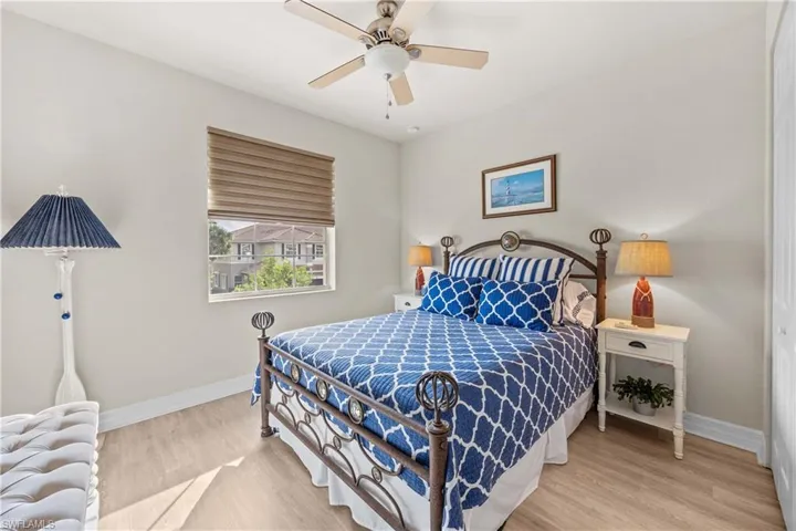 Bedroom featuring hardwood / wood-style flooring and ceiling fan