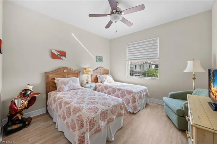 Bedroom featuring ceiling fan and light wood-type flooring