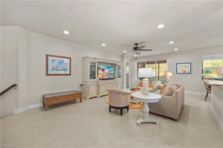 Tiled living room with ceiling fan