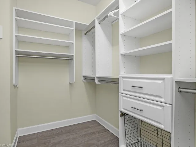 Custom built-in closets in owner bedroom.