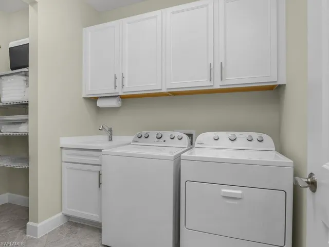 You'll LOVE the location of the laundry room, which includes additional cabinets, utility sink, and another storage closet for all your linens!