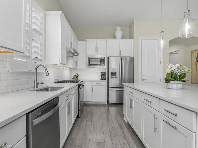 Note the under-cabinet lighting in the kitchen creating a bright and inviting space.