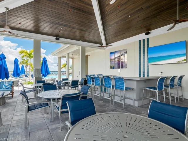Gathering space near tennis courts and lap pool.