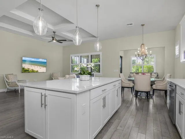 Open Kitchen, dining, sunroom and plenty of windows bringing in lots of natural light.