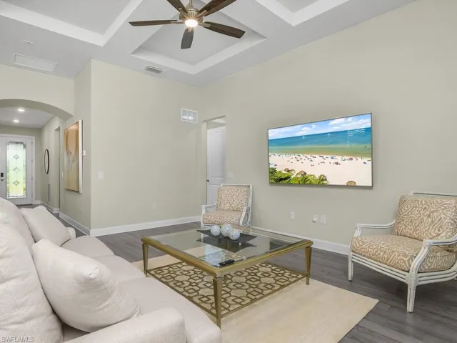 Arched entry and spacious foyer leads to open family room.