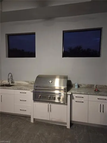 View of patio / terrace featuring area for grilling and a sink