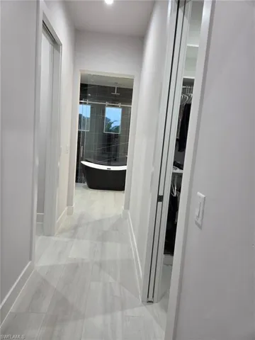 Hall featuring baseboards