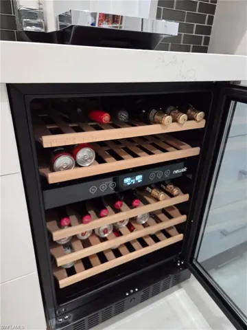 Wine room featuring wine cooler