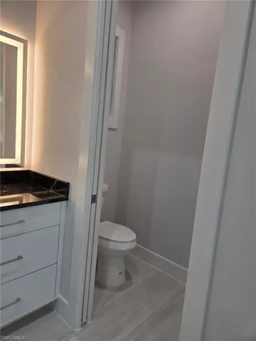 Bathroom featuring vanity and light wood finished floors