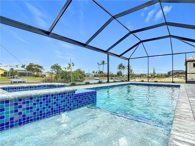Outdoor pool featuring a lanai and a patio