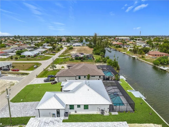 Bird's eye view with a water view and a residential view