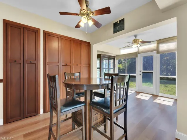 Dining space featuring light wood-style floors and a ceiling fan