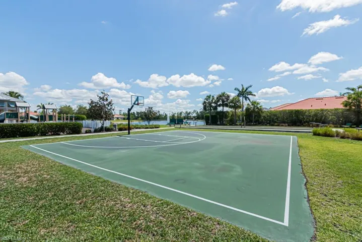 View of basketball court featuring community basketball court and a yard