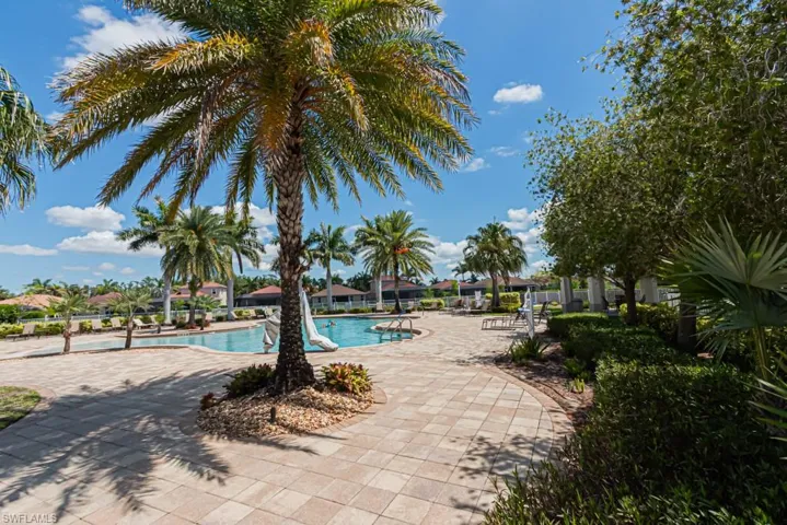 Community pool featuring a patio