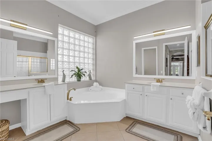ENSUITE BATH WITH SEPARATE VANITIES, SOAKING GARDEN TUB, AND WALK-IN-SHOWER