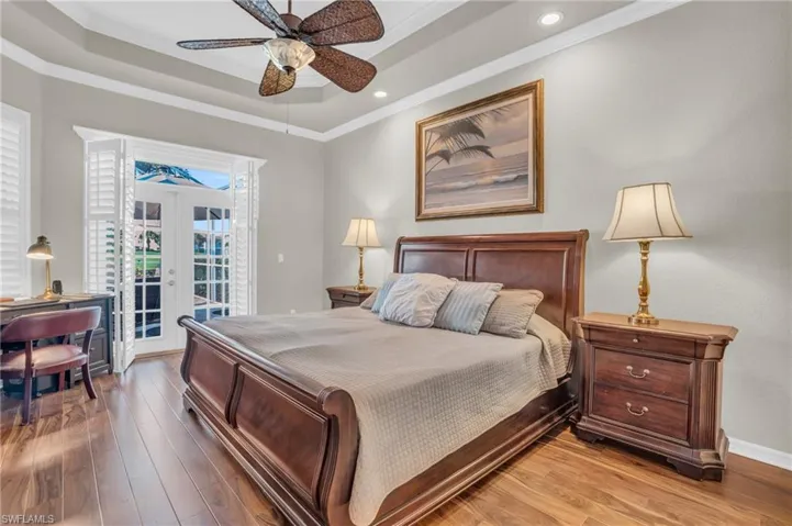 PRIMARY BEDROOM SUITE WITH FRENCH DOORS AND TRAYED CEILING