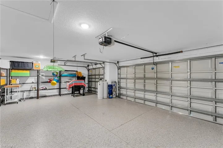 Garage featuring a garage door opener