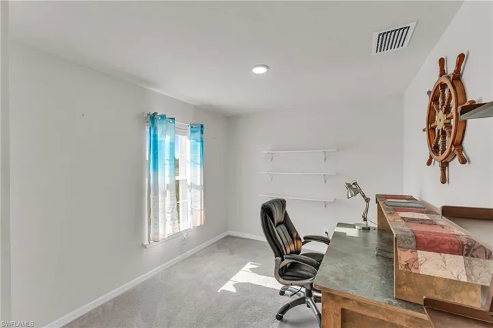 Office area with carpet flooring