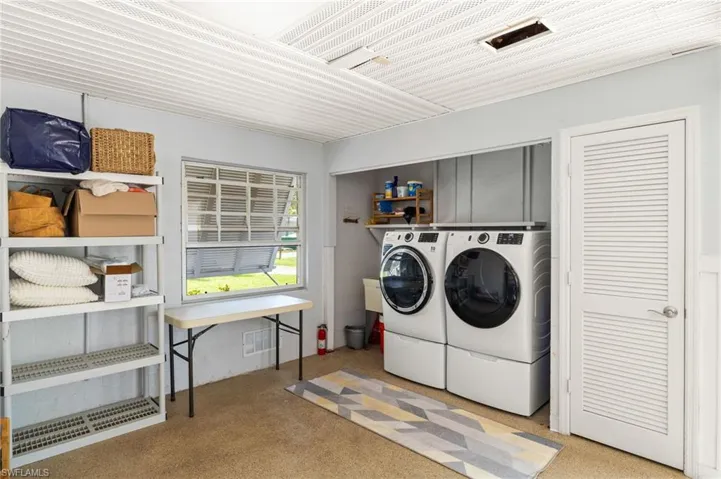 Laundry area featuring independent washer and dryer