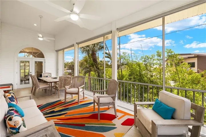 Screen enclosed lanai featuring french doors and recessed lighting