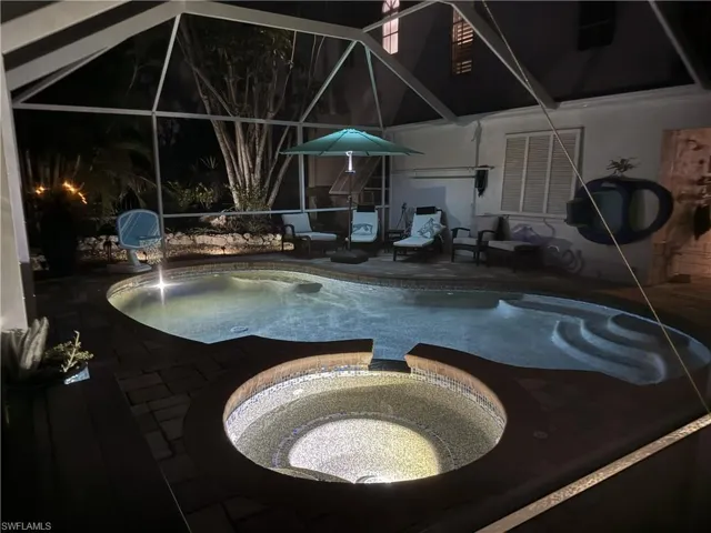 View of swimming pool and spa