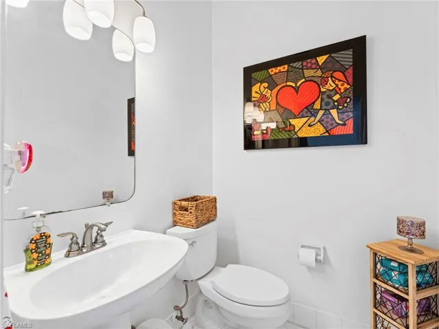 Half bath with toilet and a sink