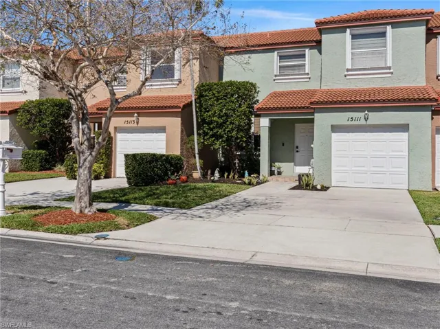 Mediterranean / spanish-style home with a tile roof, a garage, stucco siding, and concrete driveway