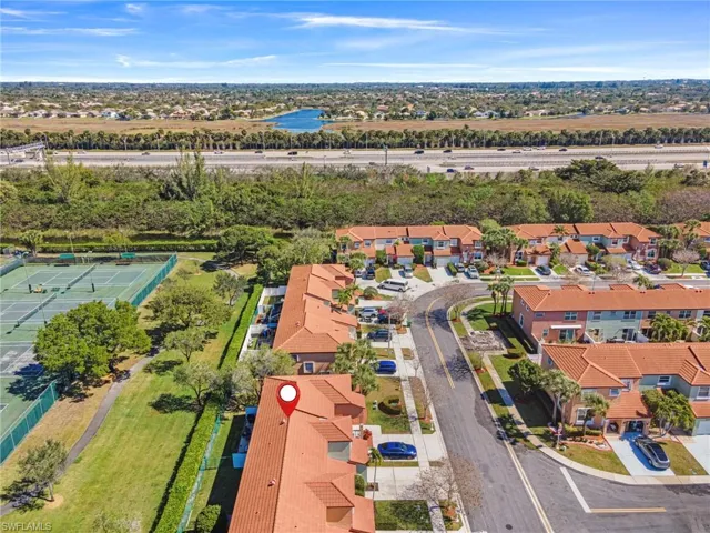 Aerial perspective of suburban area with a large body of water