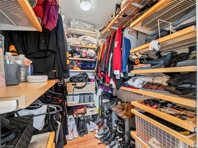 Walk in closet featuring light wood finished floors