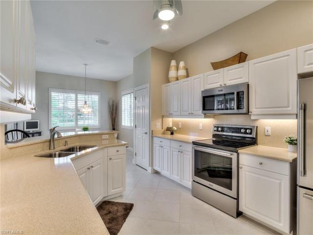 Kitchen has Cambria Quartz countertops and backsplash, and newer SS appliances