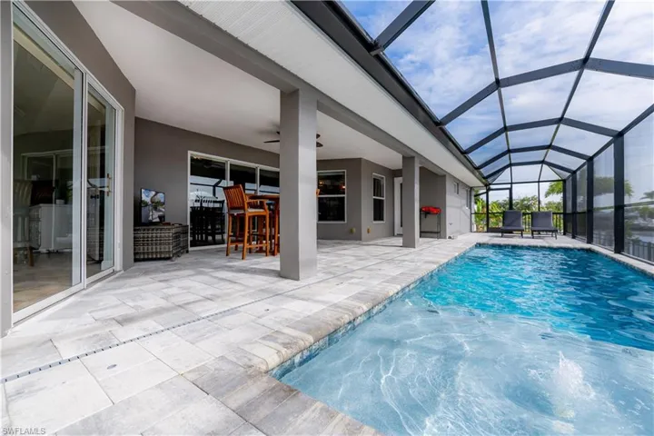 Pool has a sunshelf and bubbler